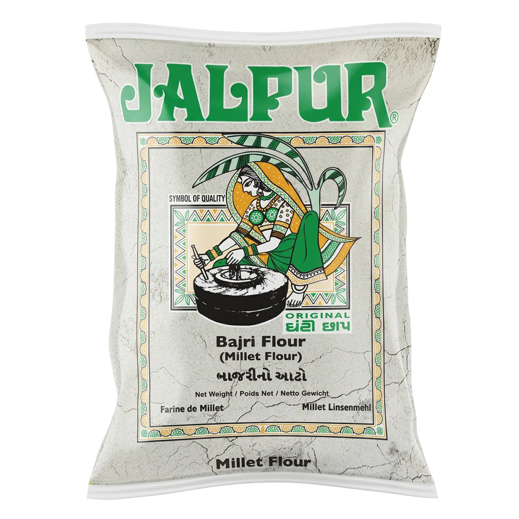 A bag of Jalpur Bajri Flour (Millet Flour) on a plain white background. The packaging is off-white with green and black text and a central illustration of a traditional figure grinding grain.
