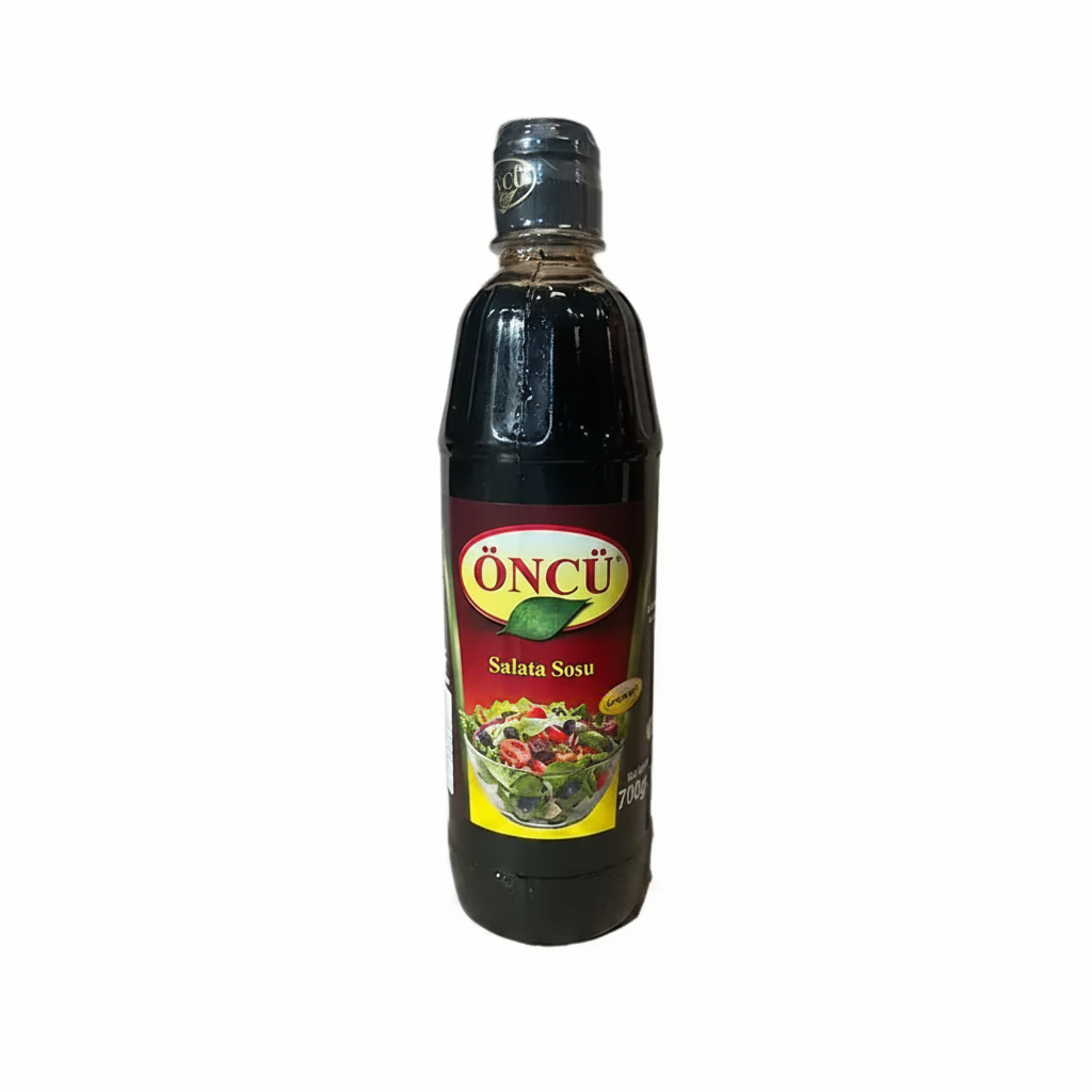 Bottle of Oncü salad dressing on a white background