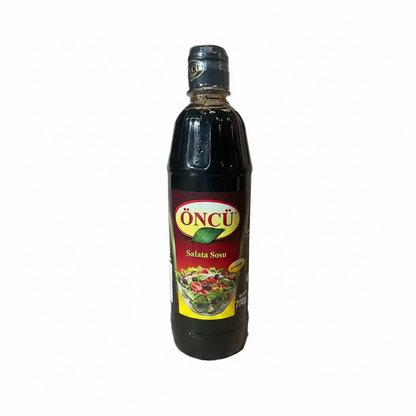 Bottle of Oncü salad dressing on a white background